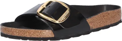 A single black Birkenstock sandal with a large gold buckle is shown against a white background.