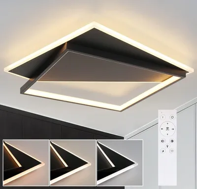A modern square LED ceiling light with a remote control.