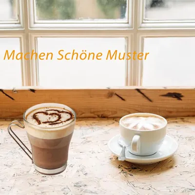 Two cups of coffee are placed on a wooden table in front of a window.