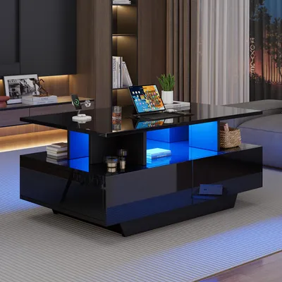 Immagine prodotto di Tavolino da divano, dimensioni 90x55x41 cm, realizzato in pannelli di particelle al 100%, colore nero, con illuminazione a LED, 2 cassetti e superficie lucida