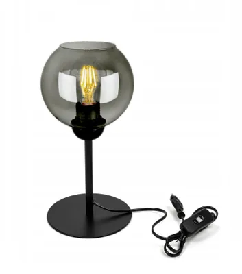 A black table lamp with a gray globe shade and a visible light bulb, shown on a white background with its power cord and switch.