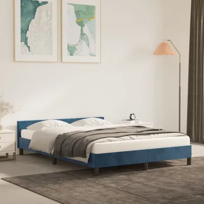 A bedroom scene with a blue bed, bedside tables, and artwork.