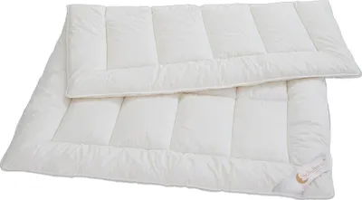 A white duvet is laid out on a white background.
