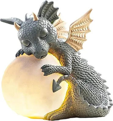 A small, gray dragon figurine is resting on a glowing, light-yellow egg.