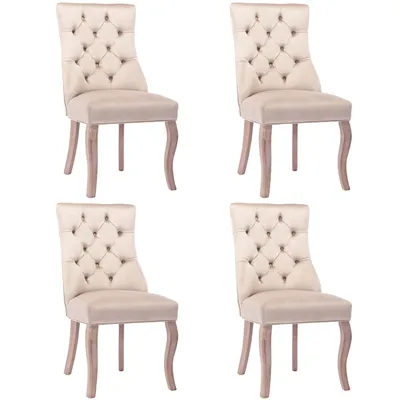 Four beige upholstered dining chairs with tufted backs and wooden legs are arranged in a two-by-two grid against a white background.