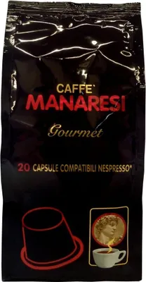 A black package of coffee capsules with branding and product imagery.