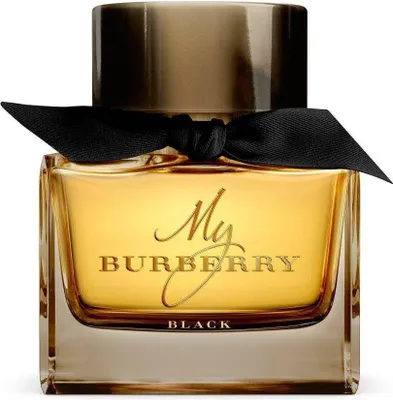 A perfume bottle with a black ribbon bow.