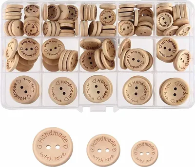 A clear, overhead shot of a clear plastic organizer box filled with wooden buttons. The buttons are round and have two holes, with "Handmade with love" stamped on them. Some buttons are stacked, while others are loose in their compartments. Below the box, 