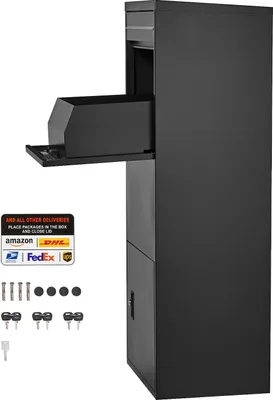 A black parcel drop box with its delivery slot open, showing a package inside. Accessories like screws, caps, and keys are laid out in the foreground.