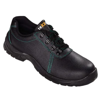 A black safety shoe with green stitching and laces, presented against a white background.