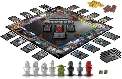 A Star Wars The Mandalorian themed Monopoly board game set up with pieces and money.