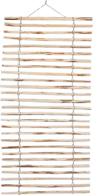 A wooden trellis for climbing plants, made of hazelnut branches, suspended by a wire.