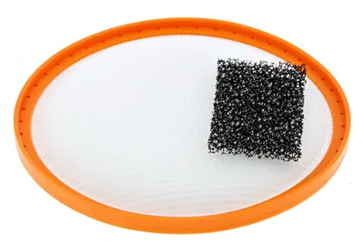 An orange ring with a white mesh screen and a black foam filter.