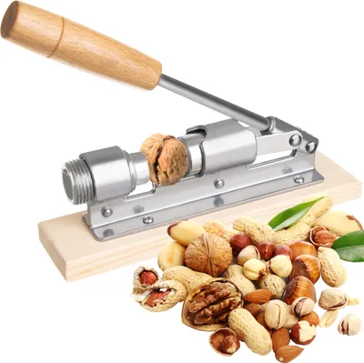 A nutcracker with a walnut being cracked, surrounded by a pile of various nuts.