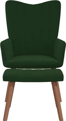 A dark green velvet armchair with wooden legs on a white background.