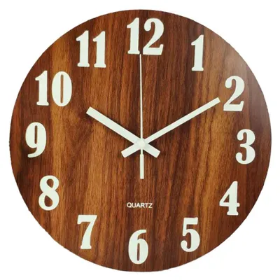 A close-up view of a round wall clock with a wood-grain pattern.