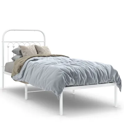 A white metal frame bed with bedding and pillows, presented against a white background.