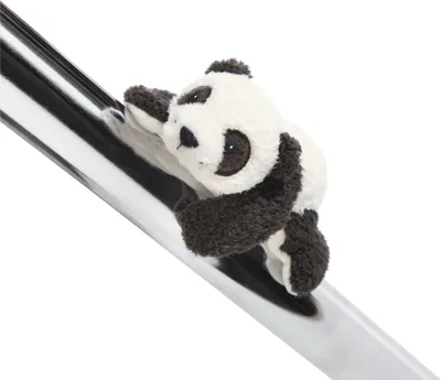 A plush panda toy is clinging to a shiny, metallic pole.