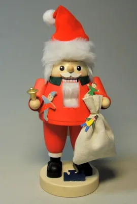Produktbild von Nussknacker Santa mit Geschenkesack bunt Höhe ca. 20cm