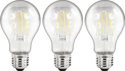 Three clear LED filament light bulbs are arranged side-by-side against a white background.