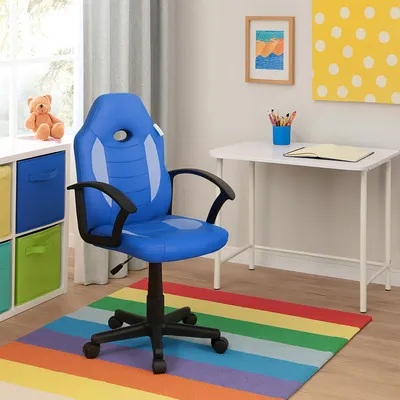 A child's desk area with a blue gaming chair, a white desk, and a rainbow rug.