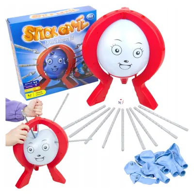 A product shot of the Spiel Boom Boom Ballon GR0097 game, showing the game box and components, with a child's hands interacting with the game.