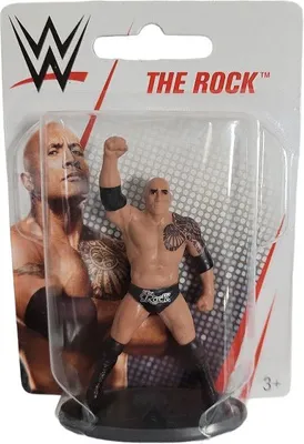 A WWE 'The Rock' action figure in its original packaging.