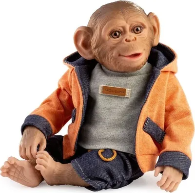 A doll of a monkey sitting down, wearing clothes.