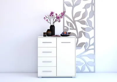 A white chest of drawers with decorative items on top, placed against a white wall.