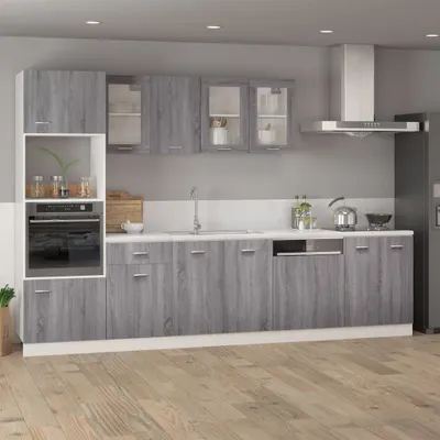 A modern kitchen with gray wood-effect cabinets and white countertops.