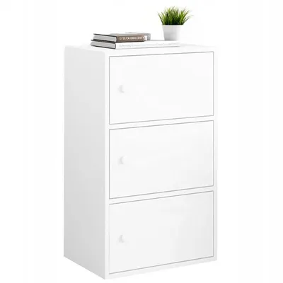 A white three-door cabinet with books and a plant on top.