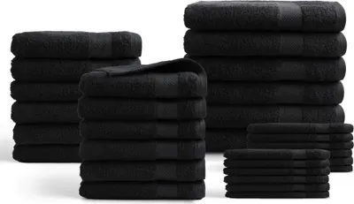 Stacks of black towels are arranged on a white background.