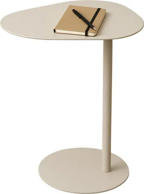 A beige side table with a notebook and pen on top, isolated on a white background.