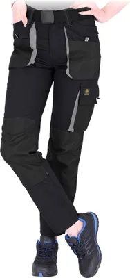 A person wearing work pants and shoes, shown from the waist down.