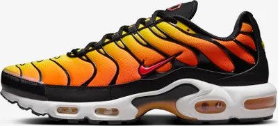 A side view of a Nike Air Max Plus TN sneaker with a sunset orange and yellow gradient.