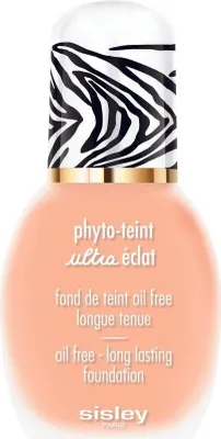 A bottle of Sisley Phyto Teint Ultra Éclat foundation with a zebra print cap.