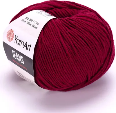 A ball of dark red yarn with a label.