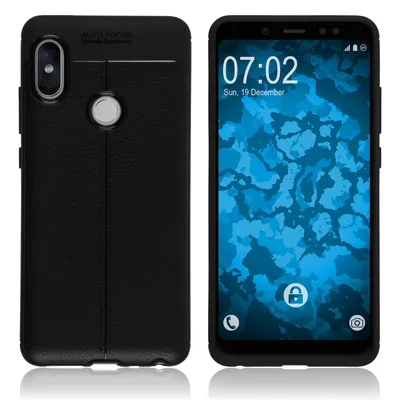 A black phone case and a smartphone with a lock screen.