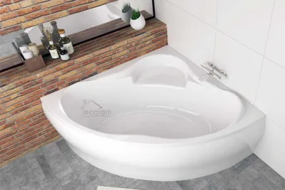 A white corner bathtub is shown in a bathroom setting with brick and tile walls.