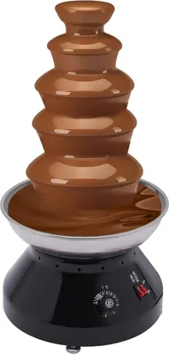 A chocolate fountain with cascading chocolate.