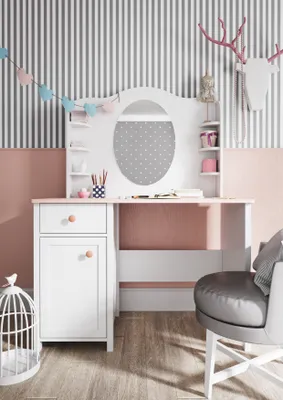A child's desk with a mirror and storage, decorated with a garland and a deer head mount.