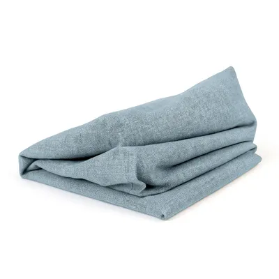 A folded blue fabric item on a white background.