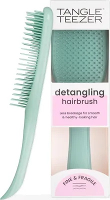 A teal Tangle Teezer detangling hairbrush is shown next to its packaging.