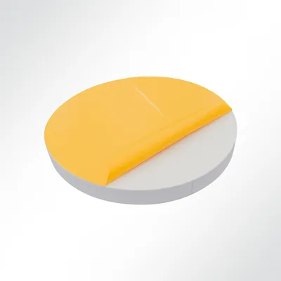 A round, gray sound absorber with a yellow protective film being peeled off.