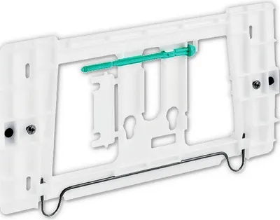 A white plastic mounting frame with a green plastic component and a black metal wire.
