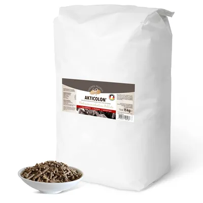 A large white bag of horse feed with a bowl of the feed in front of it.