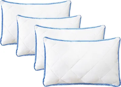 Four white pillows with blue trim are arranged diagonally.