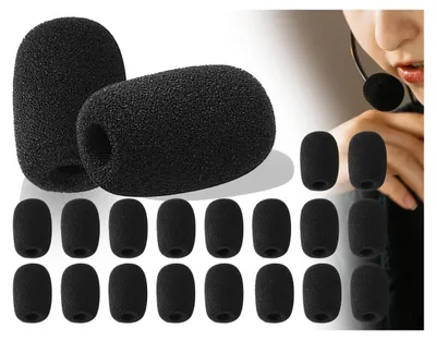 A collection of black foam microphone covers, with a person wearing a headset in the background.