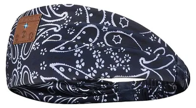 A close-up view of a black and white paisley patterned headband with a small brown square tag on the left side.