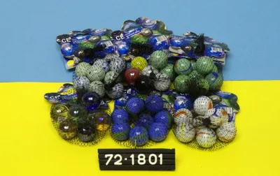 Produktbild von Murmeln im Netz 8x25mm sortiert, 24 Stück